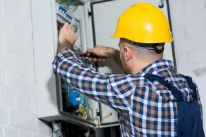SameDay electrician working on a fuse box